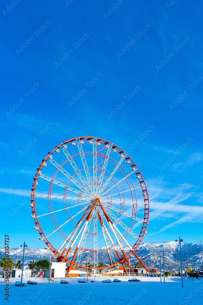 Ferris Wheel against Blue Sky in Black Sea, Batumi, Georgia