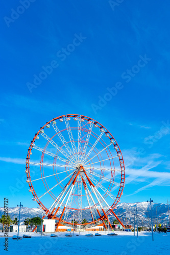Ferris Wheel against Blue Sky in Black Sea, Batumi, Georgia