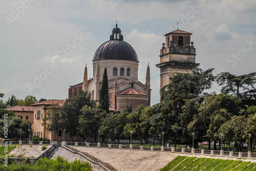 View of catholic church (Parrocchia di San Giorgio in Braida) on the riverbank of Adige river in Verona.