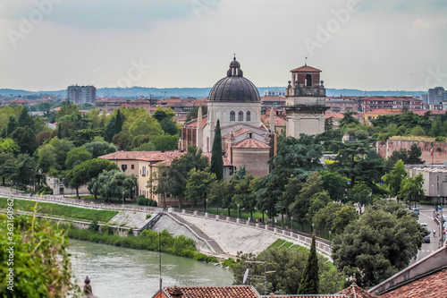 View of catholic church (Parrocchia di San Giorgio in Braida) on the riverbank of Adige river in Verona. photo