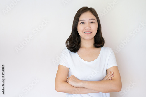Portrait of Asian beautiful woman age around 25 - 30 years old on white background with copy space. Confident Asian young adult portrait in thoughtful emotion.