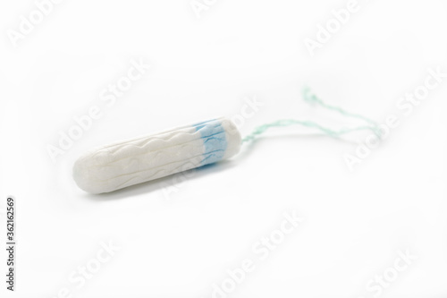 Protective white cotton tampon on a white background. Menstrual cycle.