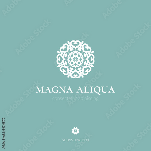 White mandala logo. Elegant, classic elements. Can be used for jewelry, beauty and fashion industry. Great for emblem, monogram, invitation, flyer, menu, brochure, background, or any desired idea.