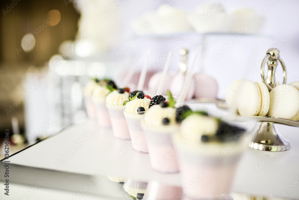 Beautiful desserts with candy bar with berries