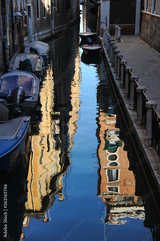 Beautiful canals with reflections in Venice, Italy