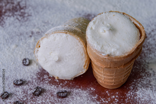 White creamy ice cream. Ice cream in a waffle cup. Close-up