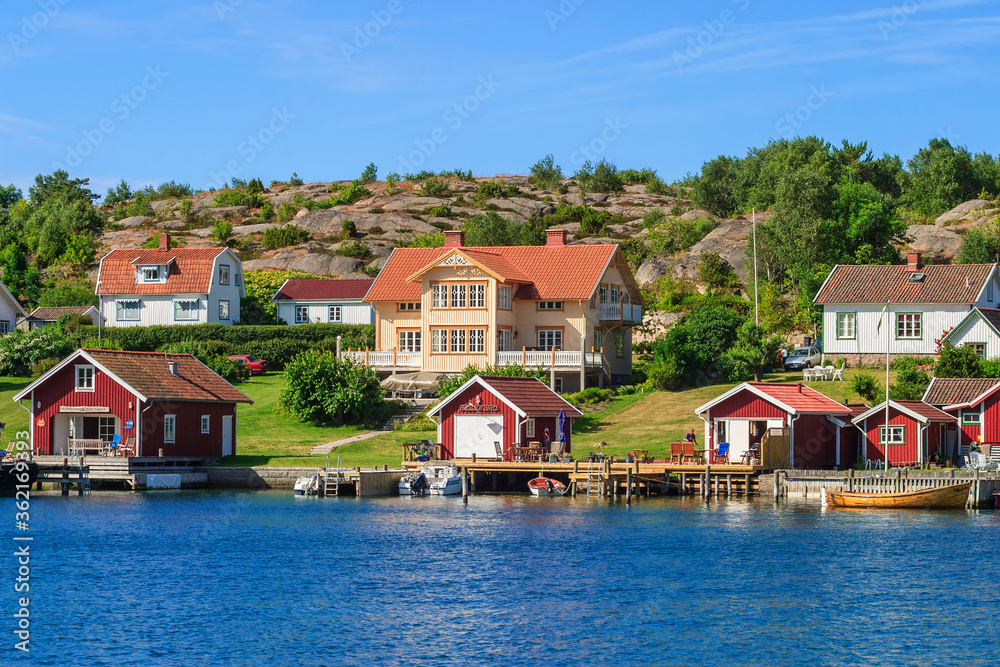 Summer houses with boats and jetties on the Swedish west coast