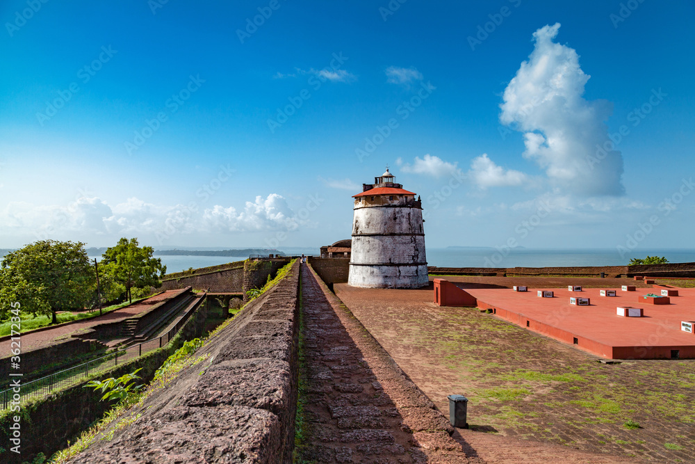 Aguada Fort - North Goa - Seventeenth-century Portuguese fort standing in Goa, India, on Sinquerim Beach - obrazy, fototapety, plakaty 