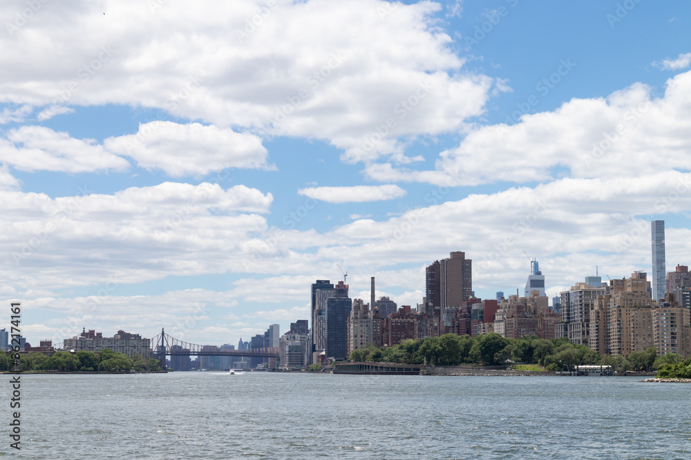 Manhattan and Roosevelt Island Skyline along the East River in New York City Manhattan and Roosevelt Island Skyline along the East River in New York City