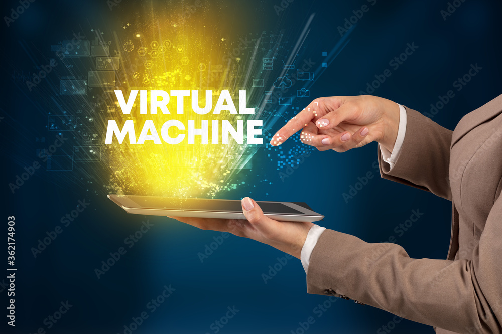Obraz premium Close-up of a touchscreen with VIRTUAL MACHINE inscription, innovative technology concept