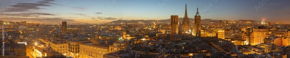 Barcelona - The panorma of the city with the old Cathedral in the centre at the evening dusk.