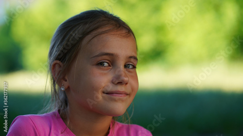 Portrait of a pretty little girl in pink dress