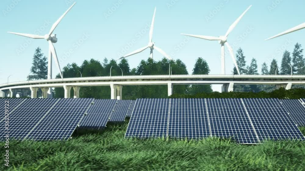 Field of solar panels with wind generators in the background