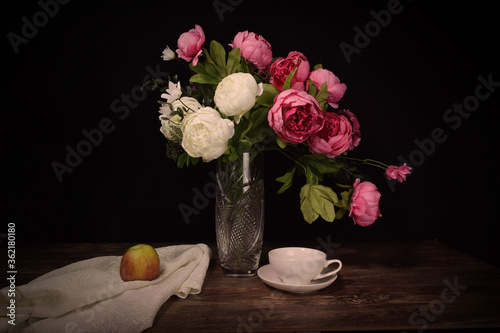 Still life in low key with black background.