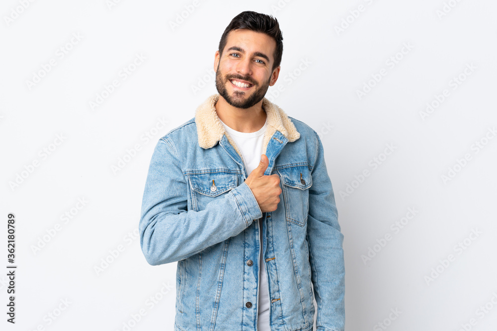 Young handsome man with beard isolated on white background giving a thumbs up gesture Young handsome man with beard isolated on white background giving a thumbs up gesture