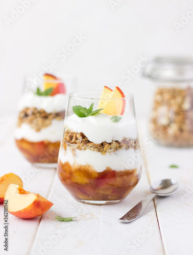 Delicious dessert with fruit yogurt and granola.  Summer, celebration, healthy, proper nutrition, female, dietary concept