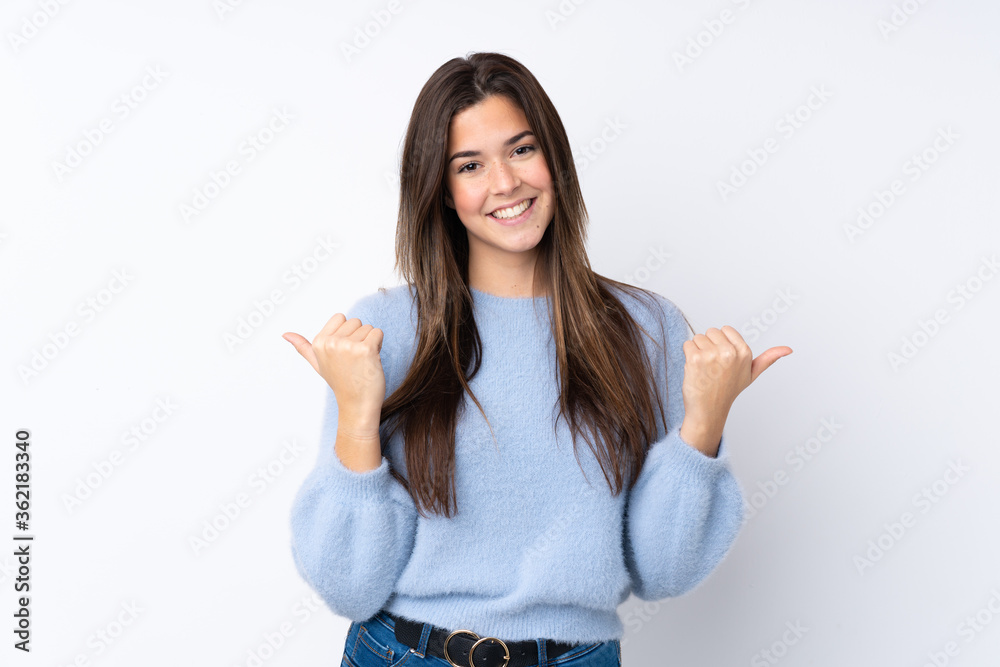 Teenager girl over isolated white background with thumbs up gesture and smiling Teenager girl over isolated white background with thumbs up gesture and smiling