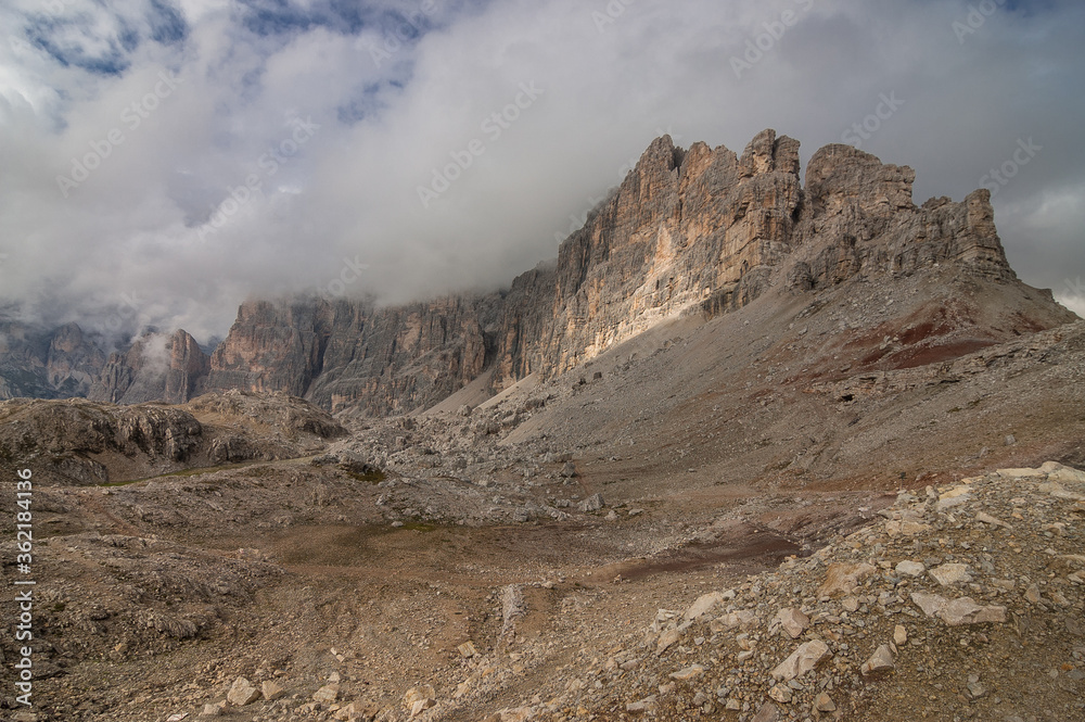 On the final stretch to  Refugio Lagazuoi at the end of the long and relentless uphill climb on stage 2 of Alta Via 1 trek from Refugio Fanes to Refugio Lagazuoi, Dolomites, South Tirol, Italy.