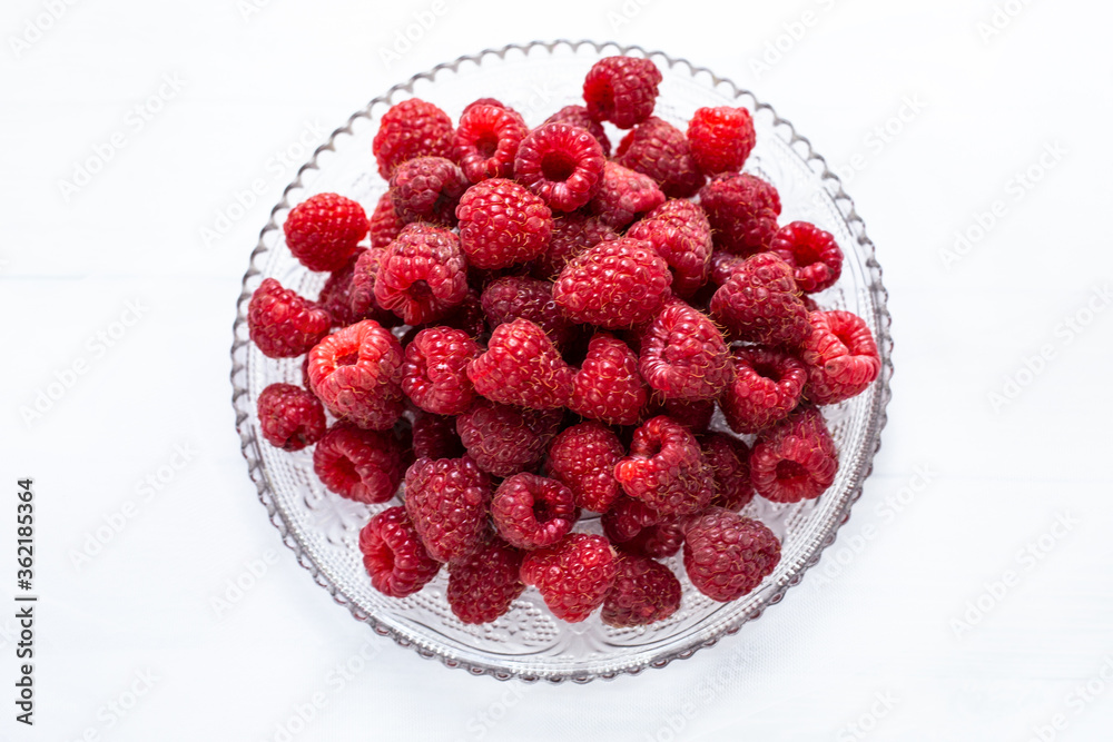 Raspberries on a plate white background Raspberries on a plate white background