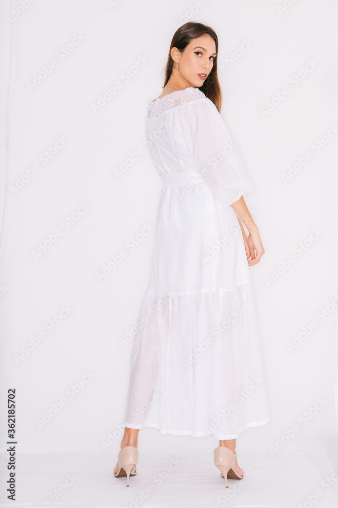 young woman in a dress, isolated on white.