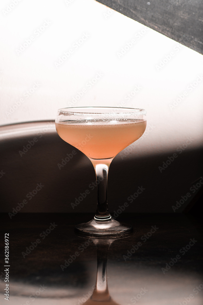 cocktail coupe with red pink drink on white background cocktail coupe with red pink drink on white background