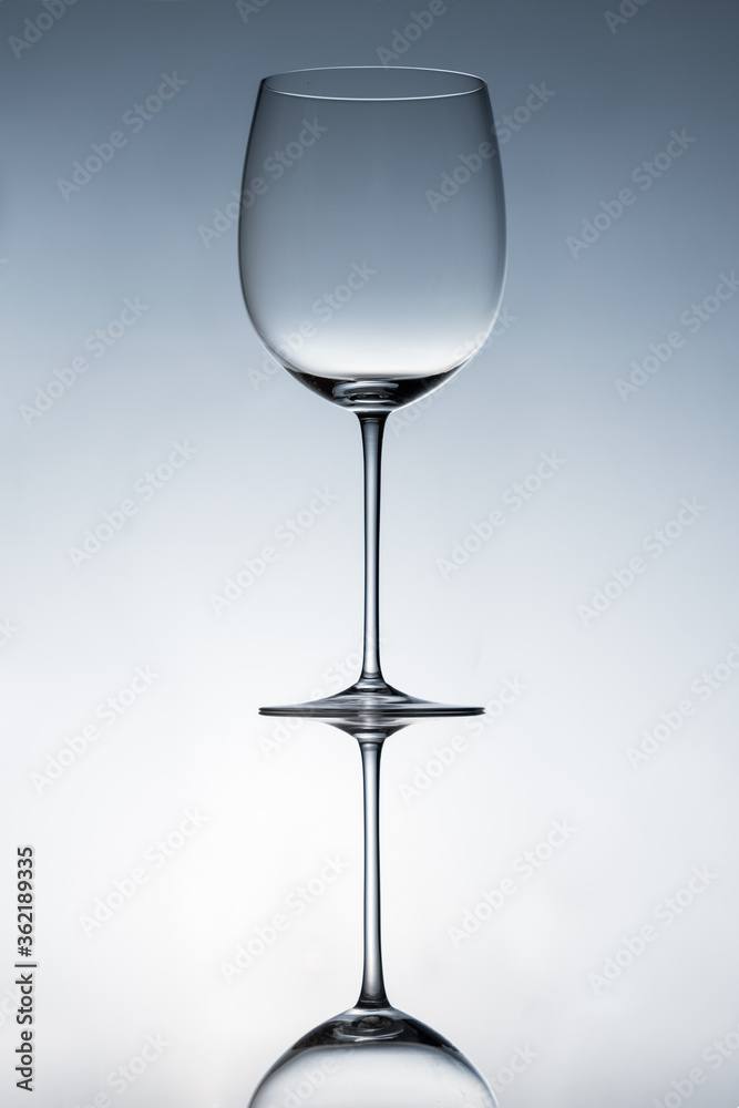 Empty wine glasses on a clean gradient background