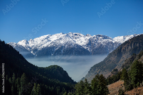 Snow covered peaks in pahalgam © artqu