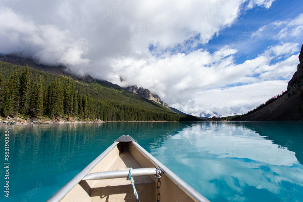 Obraz premium turquoise lake and the nose of a canoe in summer