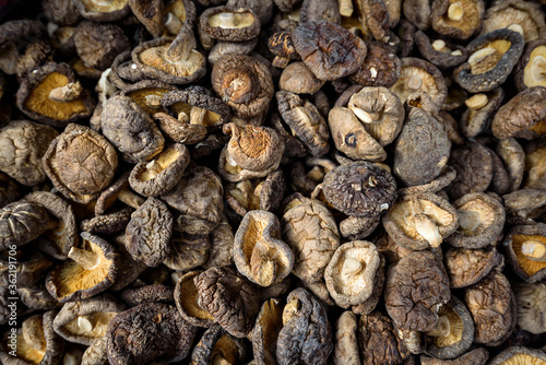dried shiitake mushrooms background , Asian cuisine food ingredient