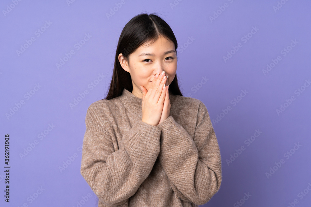 Young asian woman isolated on purple background keeps palm together. Person asks for something Young asian woman isolated on purple background keeps palm together. Person asks for something