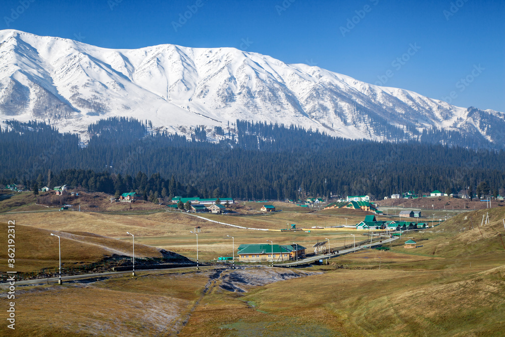 Hotels and resorts at foothills of Snow Covered Himalayan Mounta