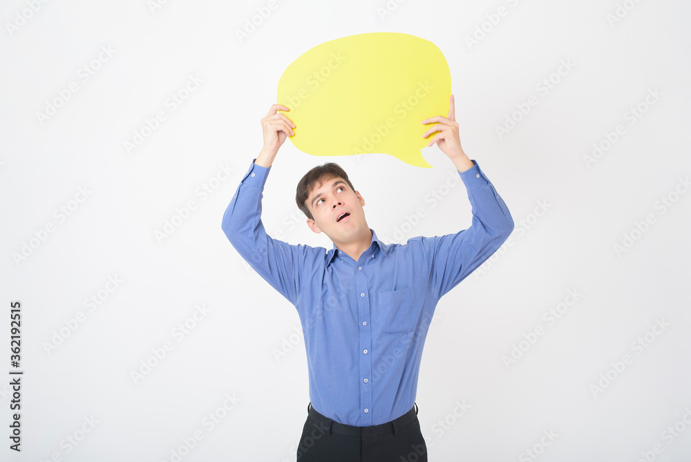 A Caucasian Middle aged Man is holding yellow empty speech on white background