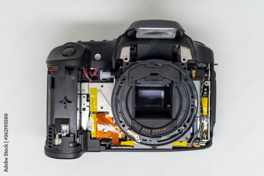 Taking apart and repairing digital camera. Close up image of camera parts. Taking apart and repairing digital camera. Close up image of camera parts.