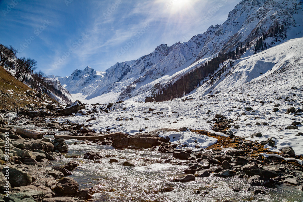 Warm sunrays creates a water stream by melting the snow of Himal