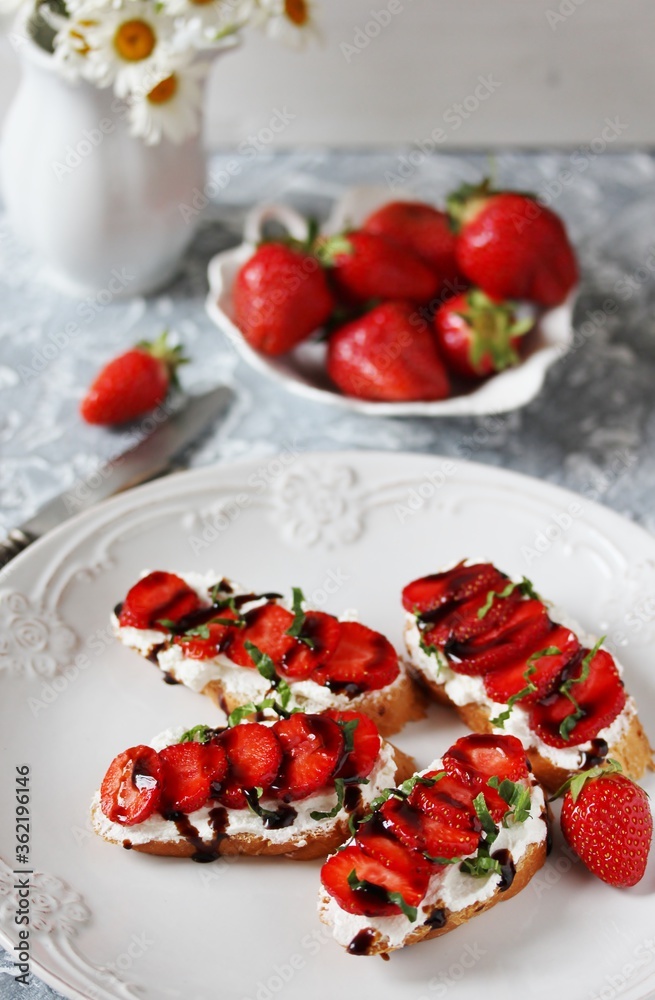 Sandwich with strawberries. With soft cheese and balsamic vinegar. Soft focus. Sandwich with strawberries. With soft cheese and balsamic vinegar. Soft focus.