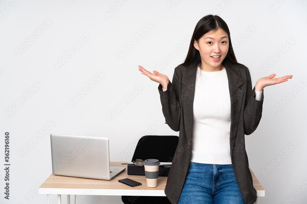 Business asian woman in her workplace isolated on white background with shocked facial expression Business asian woman in her workplace isolated on white background with shocked facial expression