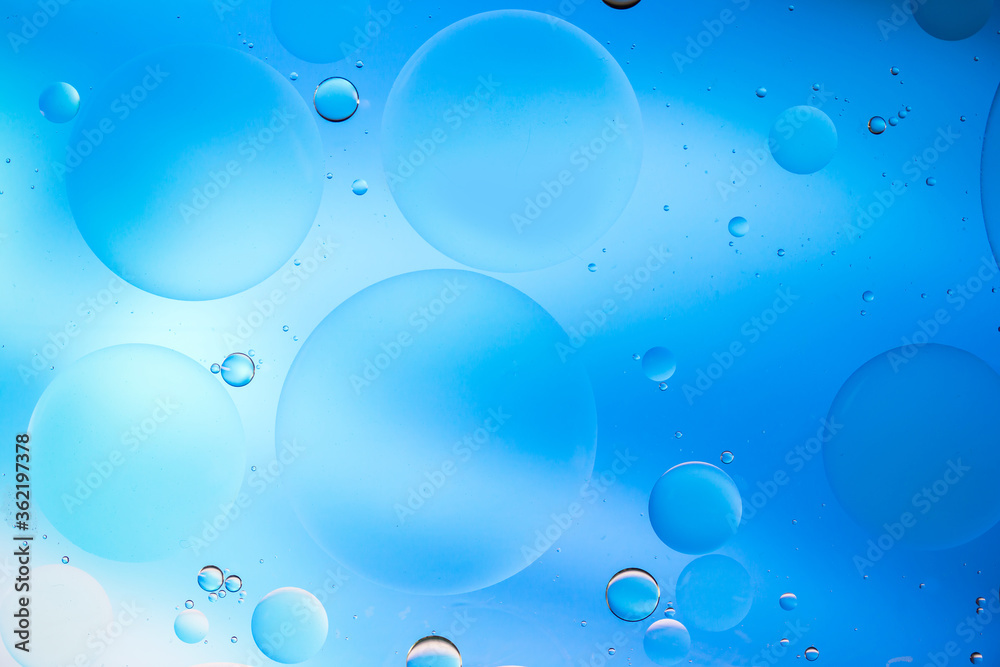 Colorful artistic image of oil drop on water for modern and creation design background.