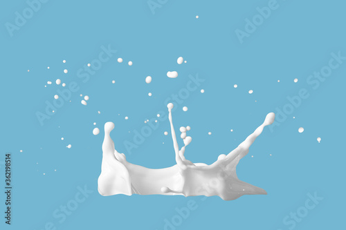Photo of milk or white liquid splash with drops isolated on blue background. Close up view © ismishko
