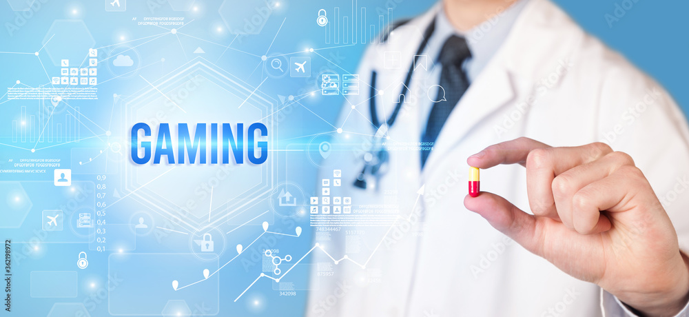 Doctor giving a pill with GAMING inscription, new technology solution concept Doctor giving a pill with GAMING inscription, new technology solution concept