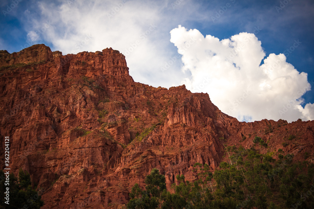 Brown and Red Stone Hill with Blue Cloudy Sky in La Paz / Bolivia Brown and Red Stone Hill with Blue Cloudy Sky in La Paz / Bolivia