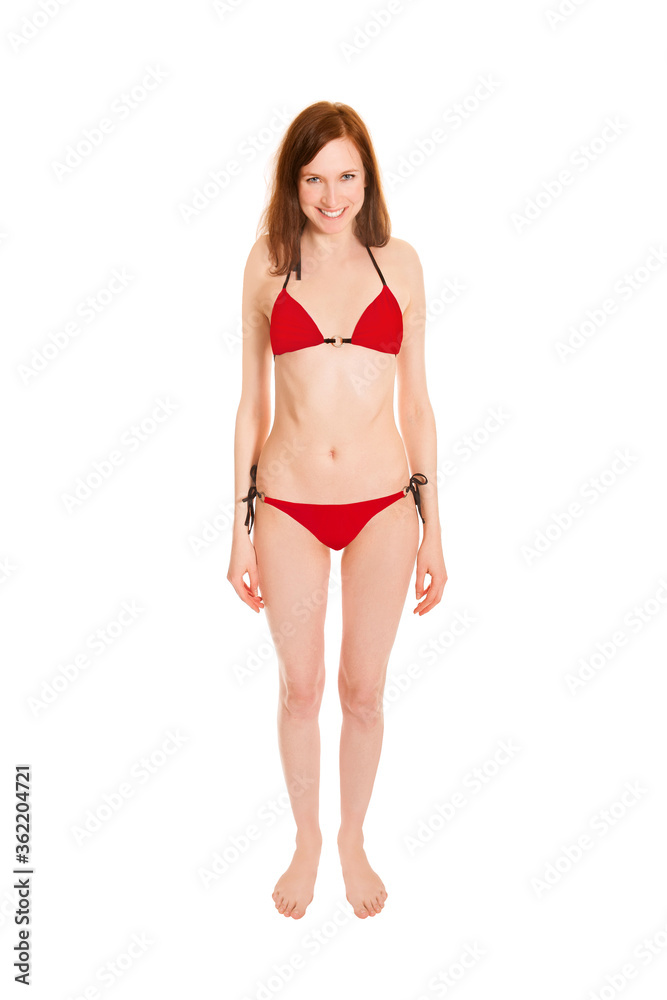 Portrait of a barefoot young woman wearing a red bikini, isolated on white studio background Portrait of a barefoot young woman wearing a red bikini, isolated on white studio background