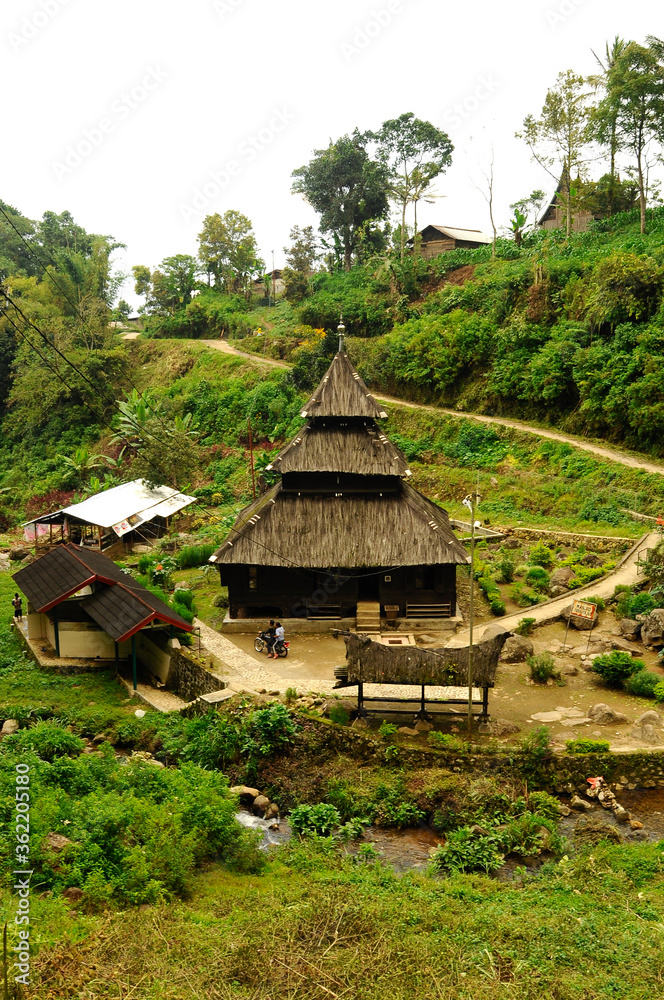 WEST SUMATERA, INDONESIA -JUNE 8, 2014: Tuo Kayu Jao Mosque is located in West Sumatra, Indonesia. Built in 1599 and is the second oldest mosque in Indonesia. WEST SUMATERA, INDONESIA -JUNE 8, 2014: Tuo Kayu Jao Mosque is located in West Sumatra, Indonesia. Built in 1599 and is the second oldest mosque in Indonesia.