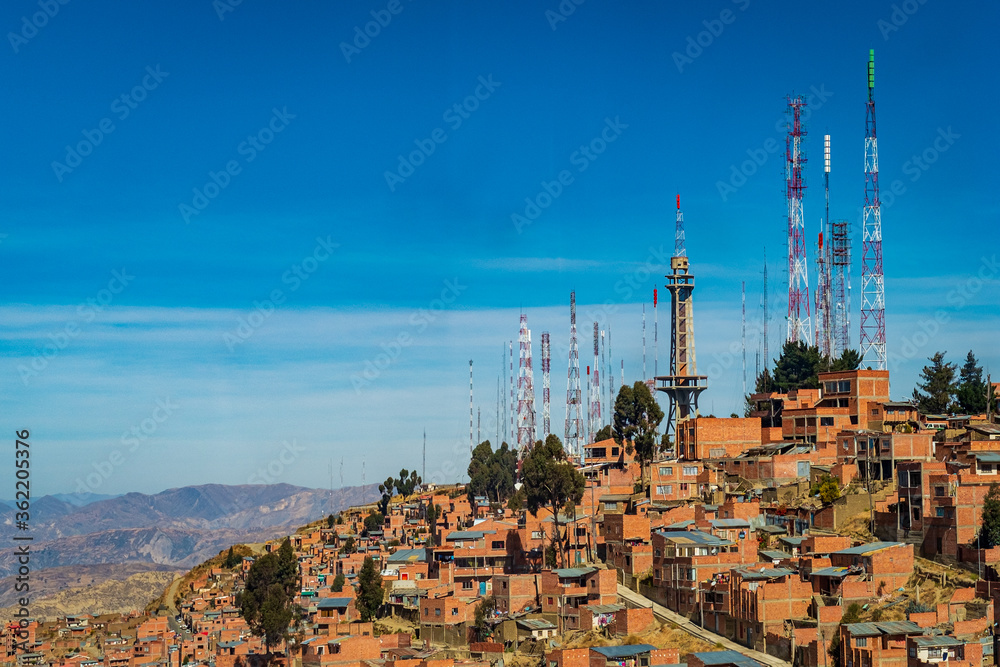 Fototapeta premium The City of La Paz, Bolivia Seen From The Sky With Mountains Peaks of The Andes Cordillera
