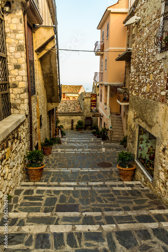 Fototapeta Naklejka Na Ścianę i Meble -  A traditional street in Castelmola above Taormina, Sicily in summer