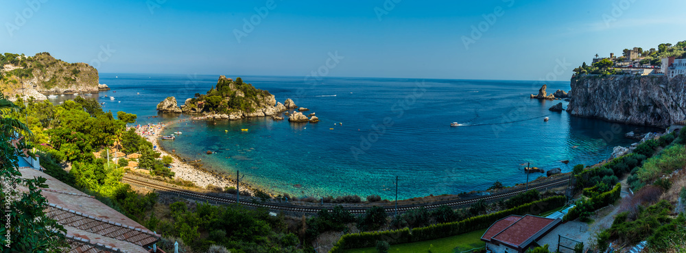 A panorama view of the shoreline and Isola Bella near Taormina, Sicily in summer