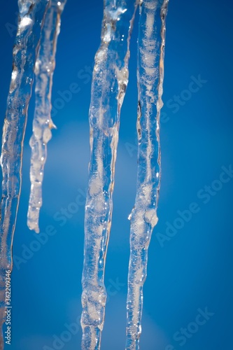 Icicles against blue sky