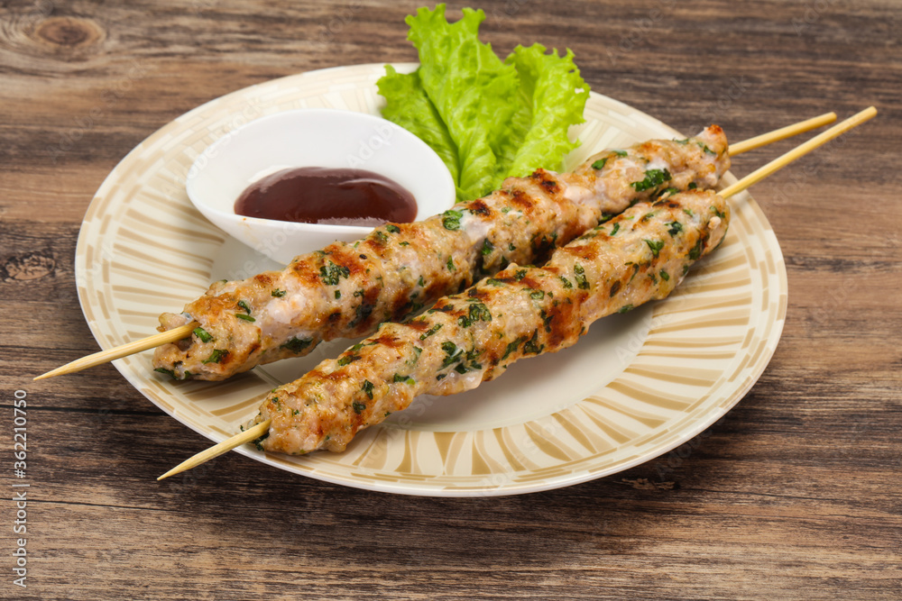Minced pork skewer kebab with sauce Minced pork skewer kebab with sauce