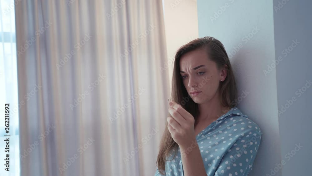 Sad lonely pensive unhappy divorced woman holds ring after breakup relationship and divorce Sad lonely pensive unhappy divorced woman holds ring after breakup relationship and divorce