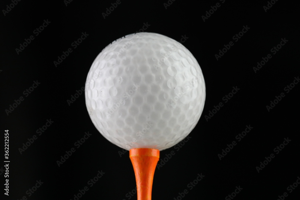 Close-up of golf Ball on a driving tee Close-up of golf Ball on a driving tee