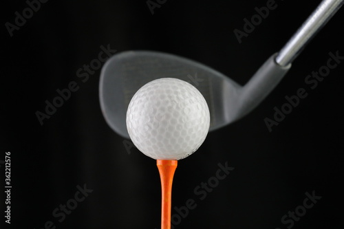 Close-up of golf club and ball